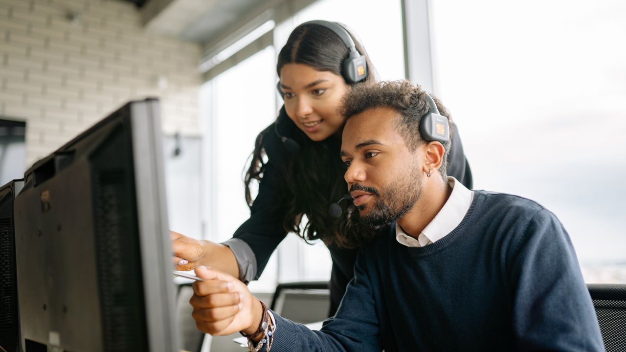 A support specialist helping a customer over a video call
